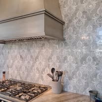 Ornate tile backsplash installation